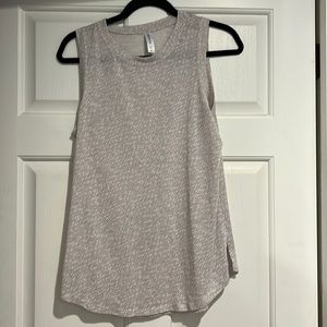 Flowy tank top. Khaki stripe detail. Material more on the sheer side